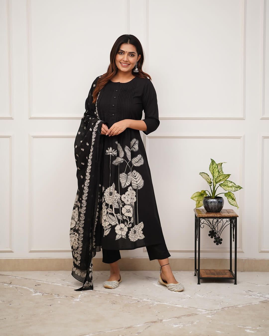 Heavy Suit Set decorated with intricate hand embroidery, zari weaving and prints