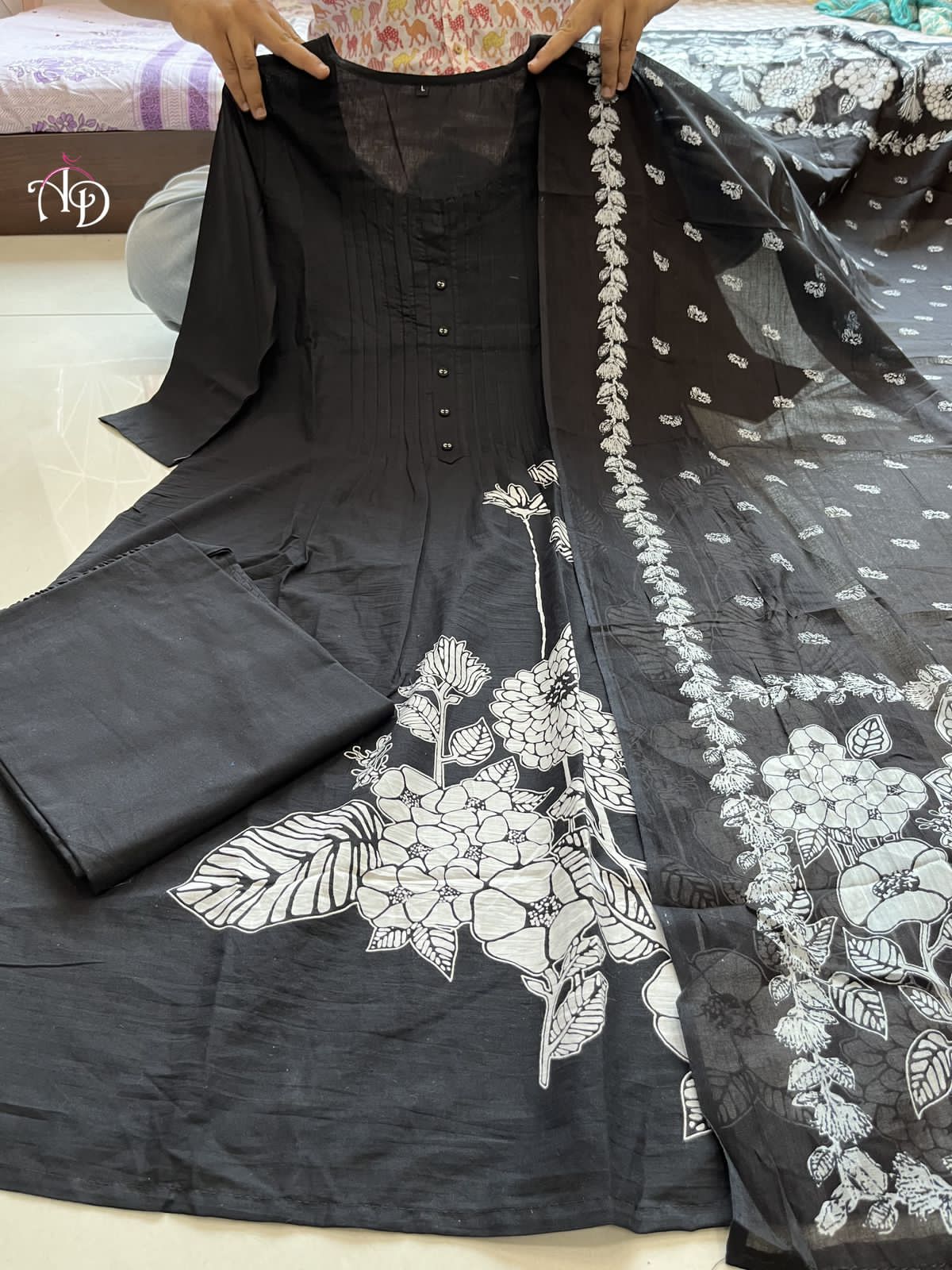 Heavy Suit Set decorated with intricate hand embroidery, zari weaving and prints