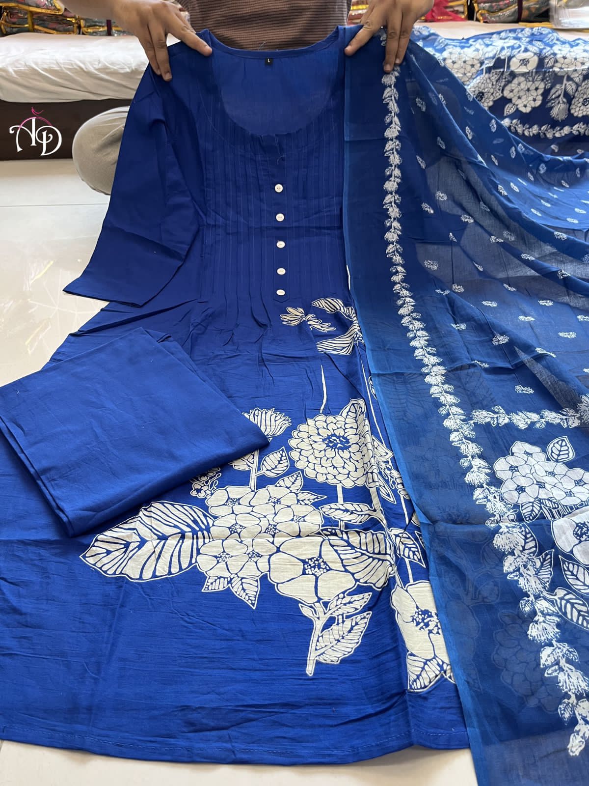 Heavy Suit Set decorated with intricate hand embroidery, zari weaving and prints