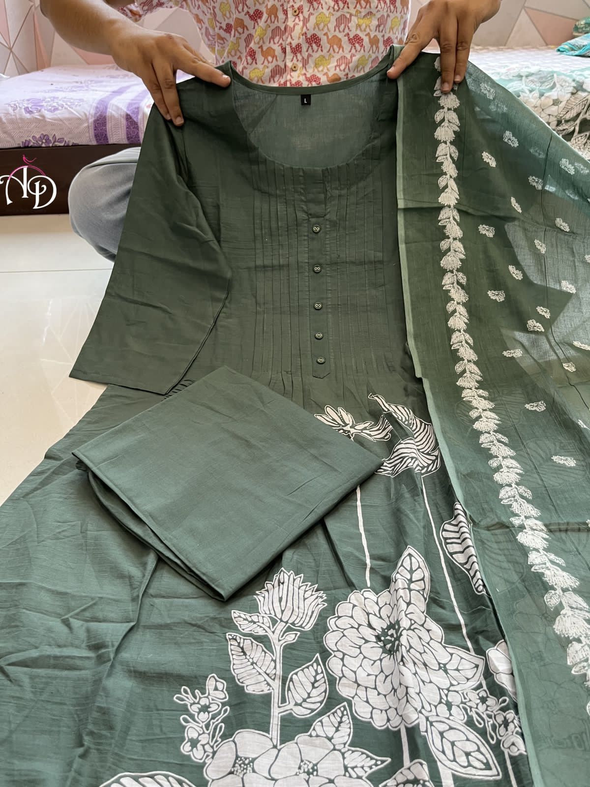 Heavy Suit Set decorated with intricate hand embroidery, zari weaving and prints