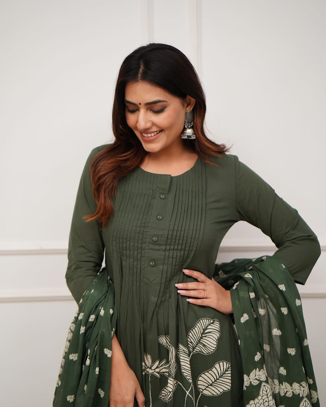 Heavy Suit Set decorated with intricate hand embroidery, zari weaving and prints